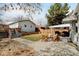 Backyard features a patio with outdoor seating, a grassy area, and fence at 4509 Eliot St, Denver, CO 80211