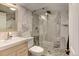 Updated bathroom features a glass shower with stylish tile work and a modern vanity at 4509 Eliot St, Denver, CO 80211