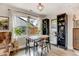 Cozy dining room filled with natural light, a stylish table and chairs, and decorative plants at 4509 Eliot St, Denver, CO 80211