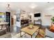 Open-concept living area showcasing a seamless transition to the kitchen with a breakfast bar and modern decor at 4509 Eliot St, Denver, CO 80211