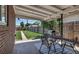 Outdoor patio with dining area and grill, perfect for entertaining with a beautiful green lawn at 3550 Magnolia St, Denver, CO 80207