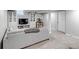 Finished basement boasts a comfortable gray sofa, neutral carpet, and built-in shelving for a welcoming space at 3550 Magnolia St, Denver, CO 80207