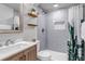 Updated bathroom with stylish tile, modern vanity, and a shower with new hardware at 3550 Magnolia St, Denver, CO 80207