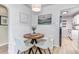 Cozy dining area with wood table, stylish chairs, and view of the kitchen at 3550 Magnolia St, Denver, CO 80207