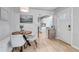 Cozy dining area with wood table, stylish chairs, and access to kitchen at 3550 Magnolia St, Denver, CO 80207