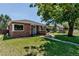 Charming brick home with a lush front yard and inviting curb appeal at 3550 Magnolia St, Denver, CO 80207