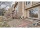 Backyard area with brick and stone landscaping with a patio at 11167 W 17Th Ave # 104, Lakewood, CO 80215