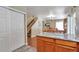 Open kitchen flowing into dining area with hardwood floors, granite countertops, and modern appliances at 12333 Newport Ct, Brighton, CO 80602
