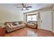 Bright living room with hardwood floors, comfortable seating, and a large window with natural light at 12333 Newport Ct, Brighton, CO 80602