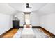 Cozy attic bedroom featuring a minimalist decor and hardwood flooring, with natural light from the window at 3737 Jason St, Denver, CO 80211