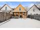 Backyard view of the house with a snowy landscape at 3737 Jason St, Denver, CO 80211