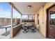 Covered patio with table and chairs, perfect for outdoor dining at 3737 Jason St, Denver, CO 80211