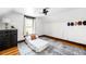 Simple bedroom featuring hardwood floors, and window at 3737 Jason St, Denver, CO 80211