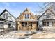 Traditional two-story home with snow-covered front yard and inviting curb appeal at 3737 Jason St, Denver, CO 80211