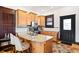 Charming kitchen features wooden cabinets, granite countertops, and modern appliances at 3737 Jason St, Denver, CO 80211