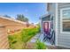 Inviting backyard area with vibrant green lawn and a charming patio area with seating at 4027 E 98Th Pl, Thornton, CO 80229