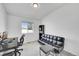 Office area in bedroom featuring a black futon, a window, and a black desk at 4027 E 98Th Pl, Thornton, CO 80229