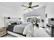 Bright bedroom with vaulted ceilings, a ceiling fan, and a large window with neighborhood views at 4027 E 98Th Pl, Thornton, CO 80229