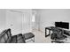 Bright bedroom area with computer desk and office chair, plus comfortable seating at 4027 E 98Th Pl, Thornton, CO 80229