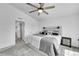 Serene bedroom featuring a comfortable bed, soft carpet, and access to a closet and bathroom at 4027 E 98Th Pl, Thornton, CO 80229