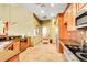 Well-equipped kitchen area with stainless steel appliances, ample countertop, and stylish cabinets at 4027 E 98Th Pl, Thornton, CO 80229