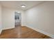Clean bedroom with hardwood floors, neutral walls and a modern light fixture at 5377 Cloverbrook Cir, Highlands Ranch, CO 80130