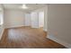 Spacious bedroom with neutral walls, wood floors, and bright natural light at 5377 Cloverbrook Cir, Highlands Ranch, CO 80130