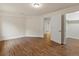 Bright bedroom featuring wood floors and a walk-in closet at 5377 Cloverbrook Cir, Highlands Ranch, CO 80130
