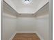 Empty walk-in closet featuring a small space and two metal hanging rods at 5377 Cloverbrook Cir, Highlands Ranch, CO 80130