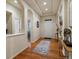 Bright hallway with hardwood floors, and decorative accents at 5377 Cloverbrook Cir, Highlands Ranch, CO 80130