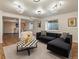 Spacious living room with modern decor, a play area, and contemporary lighting at 5377 Cloverbrook Cir, Highlands Ranch, CO 80130