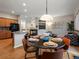 Bright and open living area with hardwood floors, fireplace and seamless access to the kitchen at 5377 Cloverbrook Cir, Highlands Ranch, CO 80130