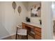 Cozy office nook with a built-in desk, stylish chair, and decorative elements at 5377 Cloverbrook Cir, Highlands Ranch, CO 80130