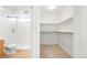 Bathroom and walk-in closet with shelving at 3855 S Monaco St # 166, Denver, CO 80237