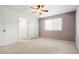 Empty bedroom with walk-in closet and ensuite bathroom at 3855 S Monaco St # 166, Denver, CO 80237