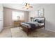 Cozy bedroom with a ceiling fan, area rug, and a window at 3855 S Monaco St # 166, Denver, CO 80237