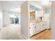 The kitchen features white cabinetry, granite countertops, and stainless steel appliances at 3855 S Monaco St # 166, Denver, CO 80237