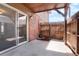 Private patio with sliding glass door and wooden fence at 3855 S Monaco St # 166, Denver, CO 80237