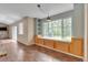 Bright breakfast nook with built-in bench seating and a large window at 1038 Tenderfoot Dr, Larkspur, CO 80118