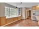 Bright dining area boasts a window seat, built-in shelves, and tile flooring for easy maintenance and style at 1038 Tenderfoot Dr, Larkspur, CO 80118