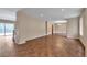 Expansive living area with wood-look floors and neutral wall colors at 1038 Tenderfoot Dr, Larkspur, CO 80118