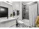 Clean bathroom with a bathtub, shower, and modern fixtures at 3116 N Gilpin St, Denver, CO 80205