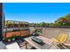 Modern rooftop deck with city views, fire pit, and comfortable seating at 3116 N Gilpin St, Denver, CO 80205