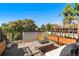 Relaxing rooftop deck with seating area, fire pit, and planters, offering city views at 3116 N Gilpin St, Denver, CO 80205