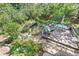 Secluded backyard deck with dining and lounge seating and a fish pond at 1080 Ithaca Dr, Boulder, CO 80305