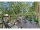 Outdoor deck featuring a grill, seating, dining table and plants at 1080 Ithaca Dr, Boulder, CO 80305