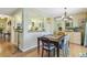 Charming dining room with wood table, chandelier, and stylish decor, adjacent to kitchen at 1080 Ithaca Dr, Boulder, CO 80305