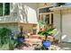 Close-up of front door with brick accents, potted plants, and visible house number at 1080 Ithaca Dr, Boulder, CO 80305