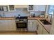 Modern kitchen with butcher block counters, stainless steel gas range, and white subway tile backsplash at 1080 Ithaca Dr, Boulder, CO 80305