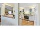 Efficient kitchen with white cabinets, stainless steel appliances, and view to the living areas at 1080 Ithaca Dr, Boulder, CO 80305